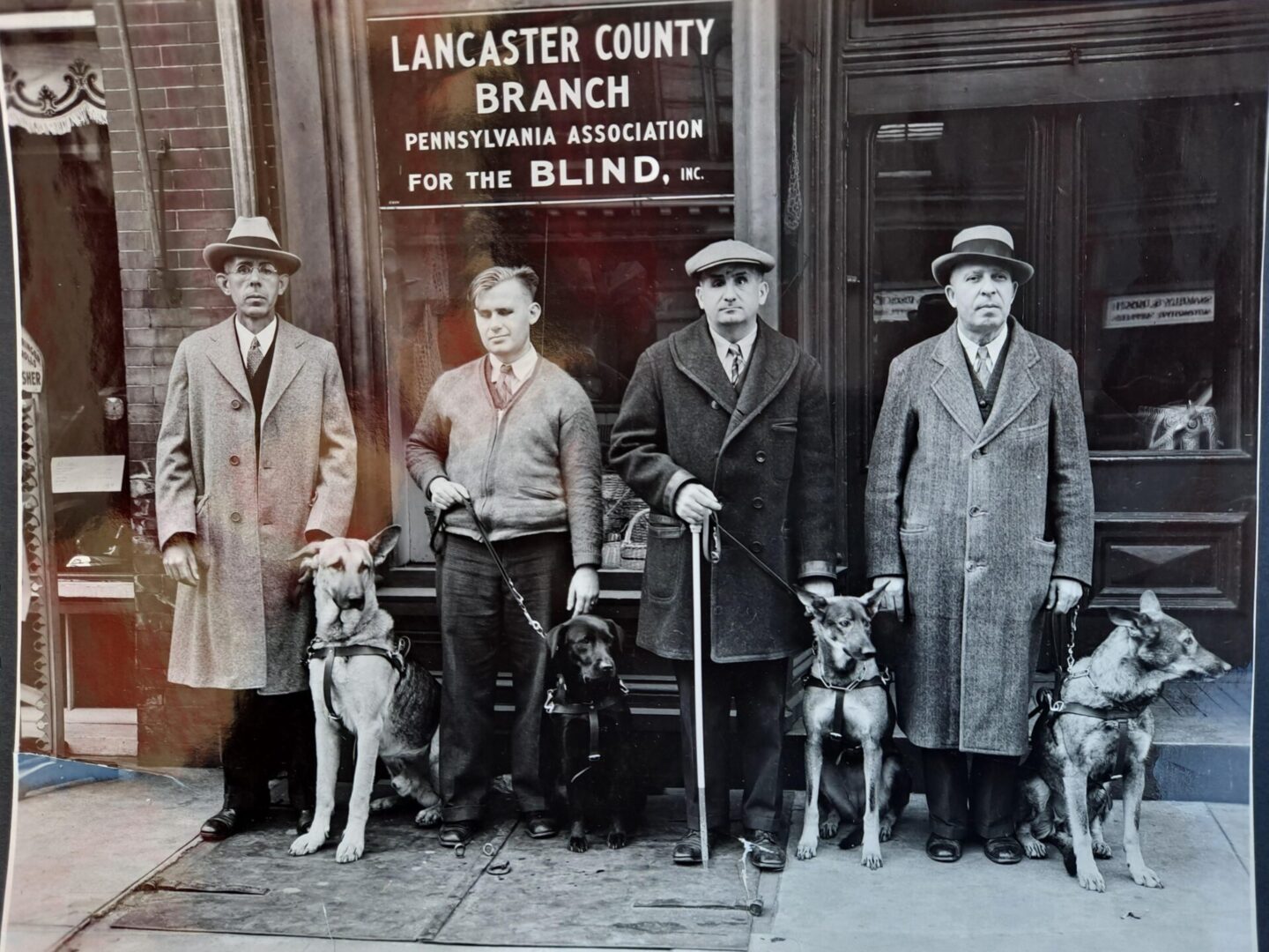 Four men standing in front of Lanchester County branch