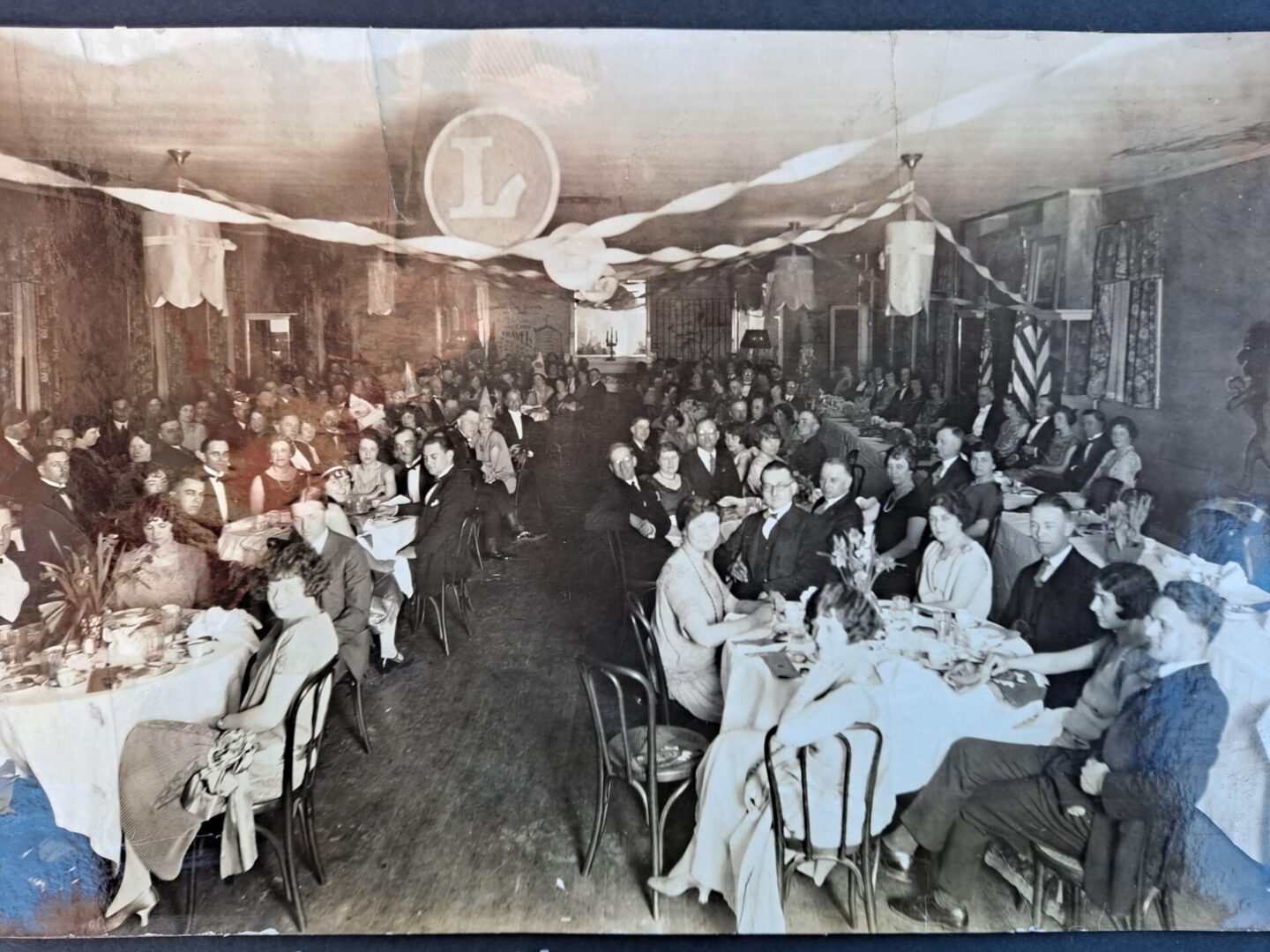 Old photo of people sitting at an event