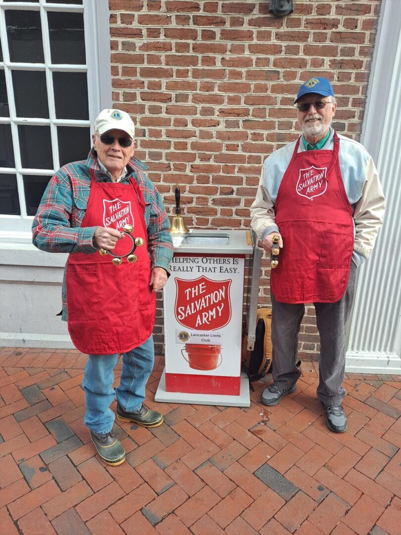 Two Men Standing With Salvation Army Aprons